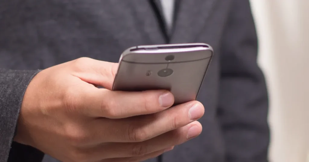 The person is looking at a job search website on their mobile phone.